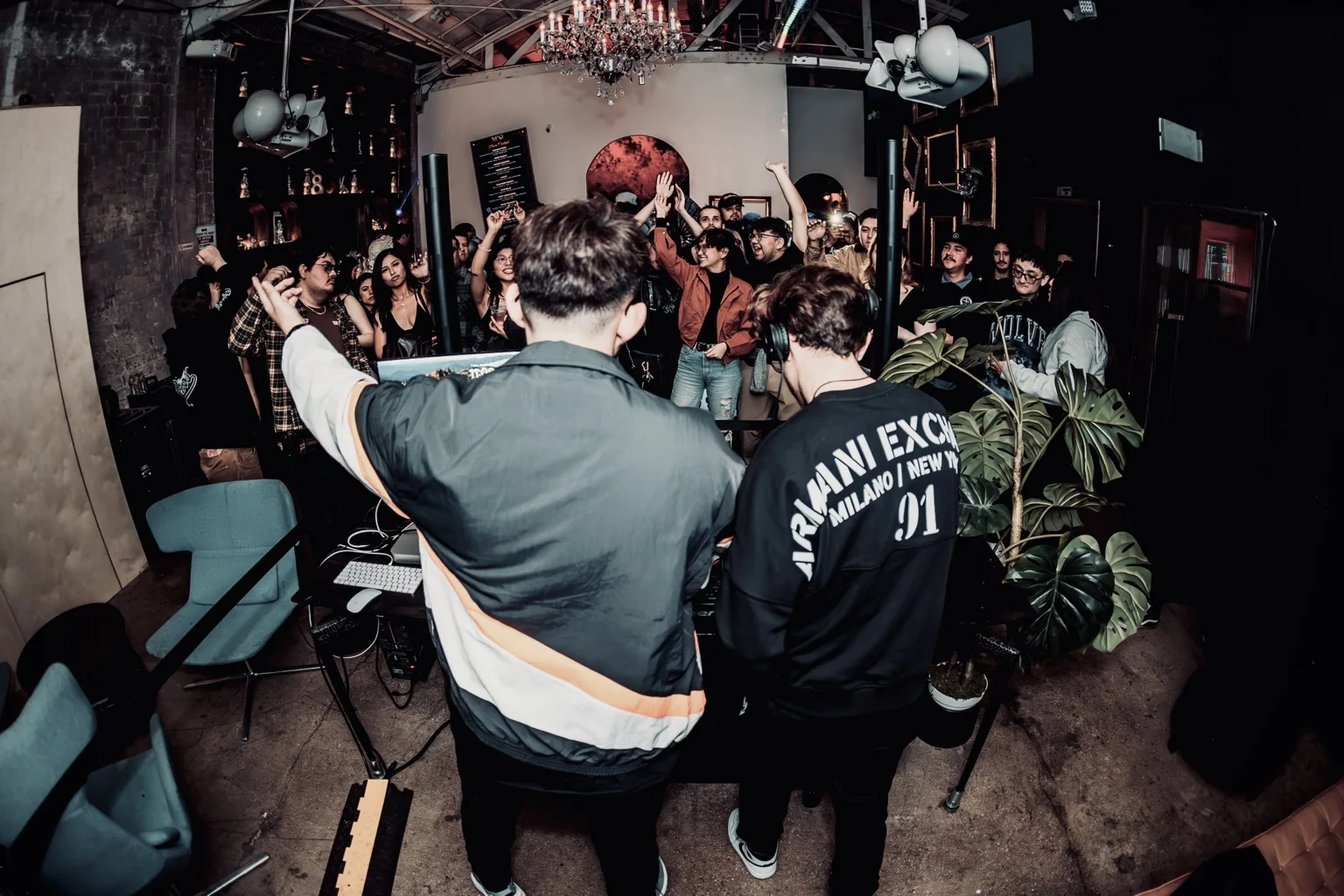Jason Bleu performing for a crowd at an underground event